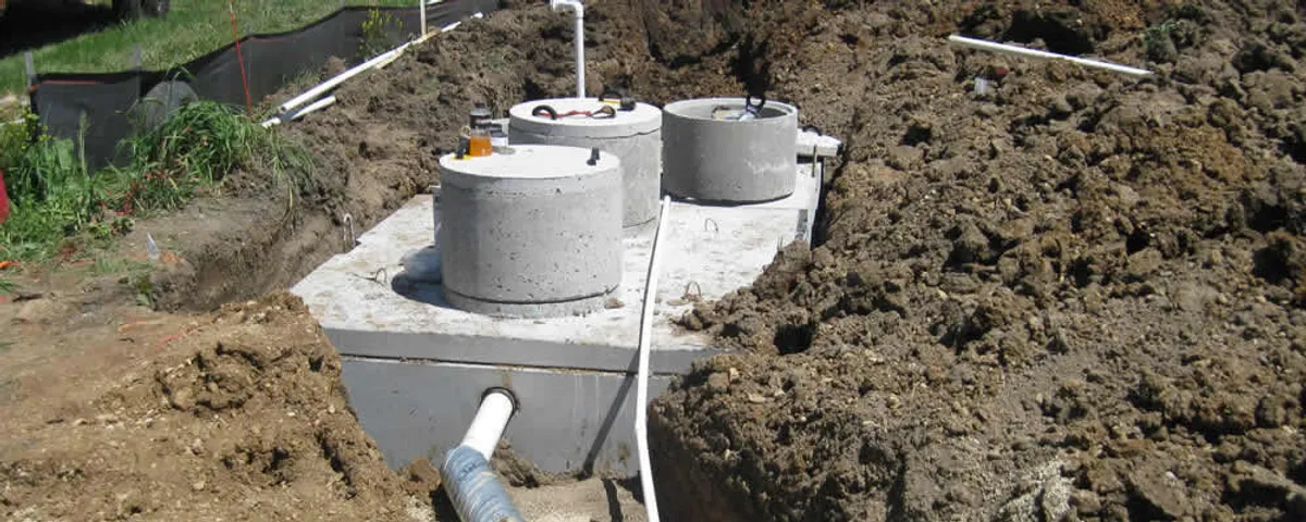 Septic system repair and installation site with tank access ports in Lynchburg, VA